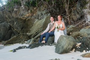a couple at the rocks at hawksnest beach