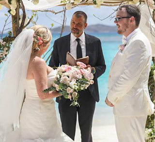 Island Mike officiates a wedding at Lindquist Beach, St. Thomas