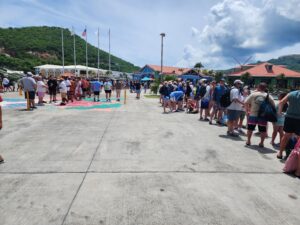 lines of passengers getting off the ship at crown bay marina